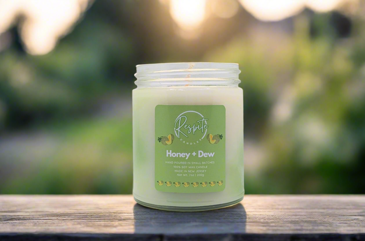 Candle with a green label on a white background
