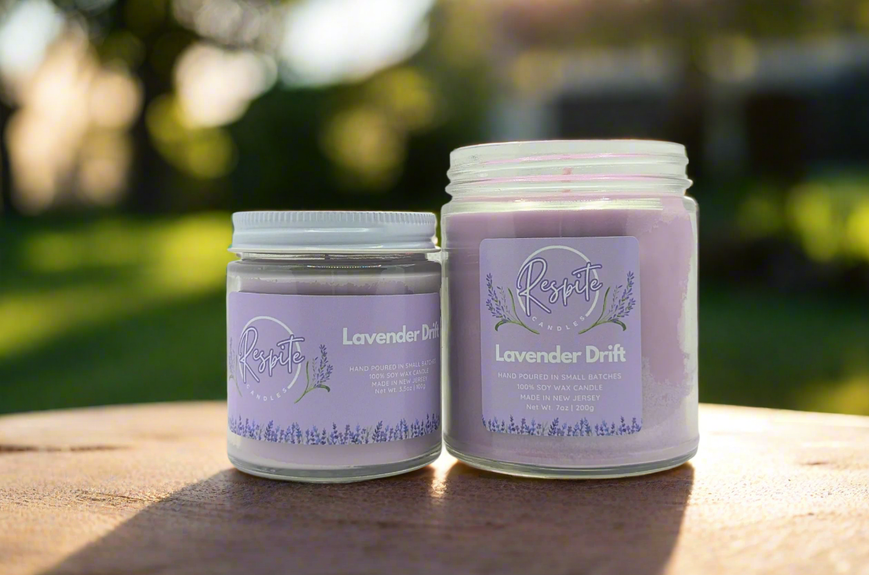 Two lavender-scented candles with purple labels on a white background