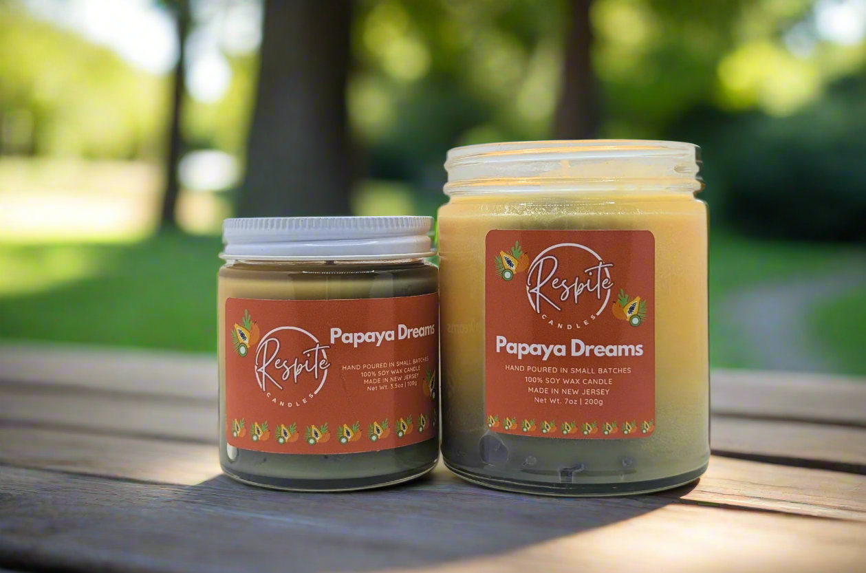Two jars of 'Papaya Dreams' by Respite on a white background
