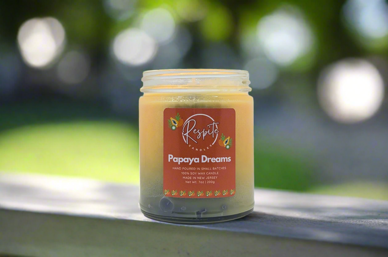 Candle with 'Respite' brand label on a white background