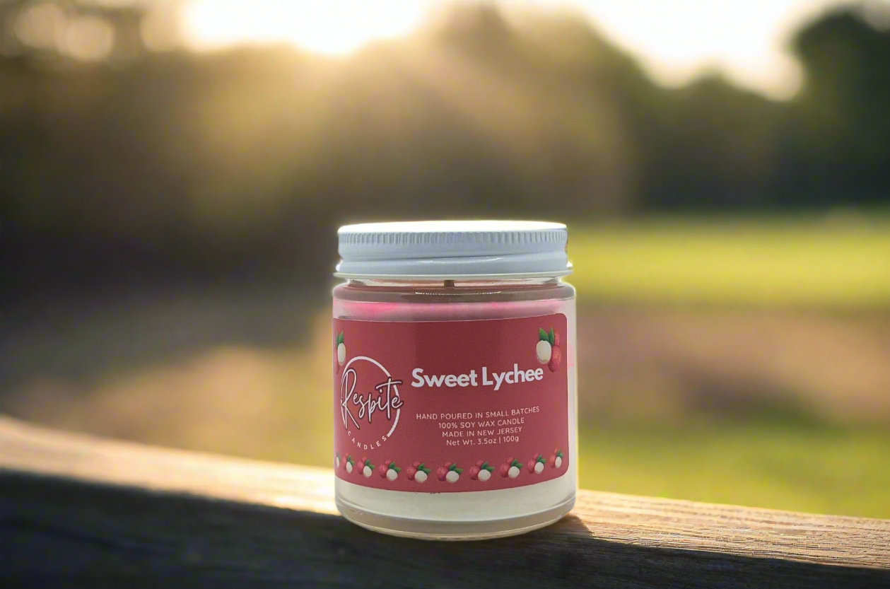 Candle with a pink label on a white background