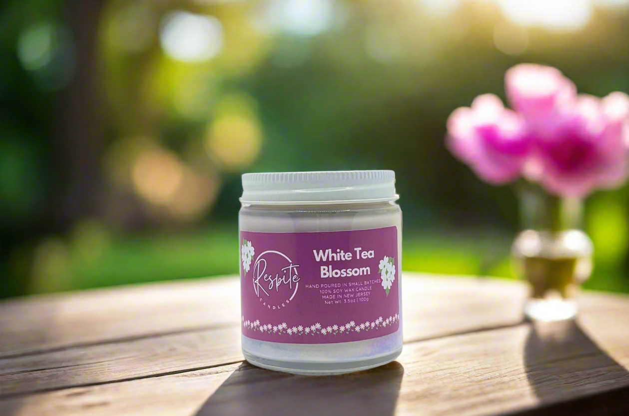Jar of 'White Tea Blossom' candle on a white background