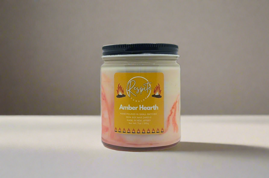 Candle jar with 'respite' brand label on a white background