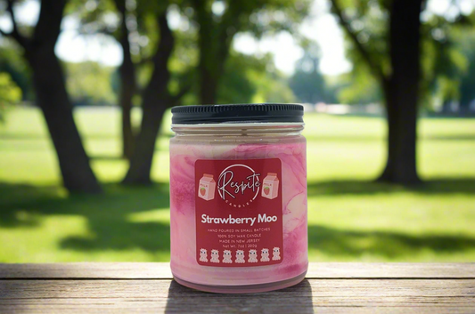 Pink candle jar with a label on a white background